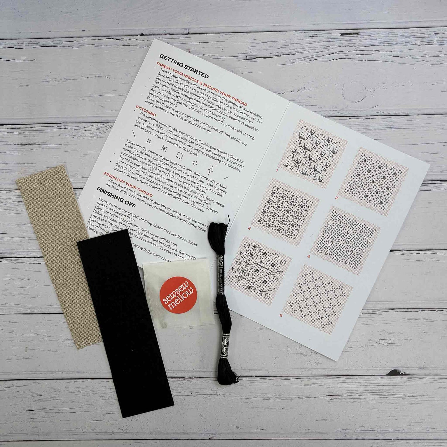 Blackwork Bookmark Kit Contents - linen bookmark, felt backing fabric, coton a broder, needles and needle threader and stitch guide.