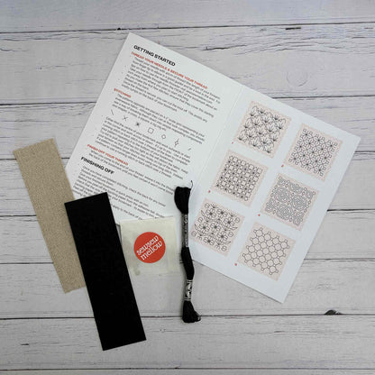 Blackwork Bookmark Kit Contents - linen bookmark, felt backing fabric, coton a broder, needles and needle threader and stitch guide.