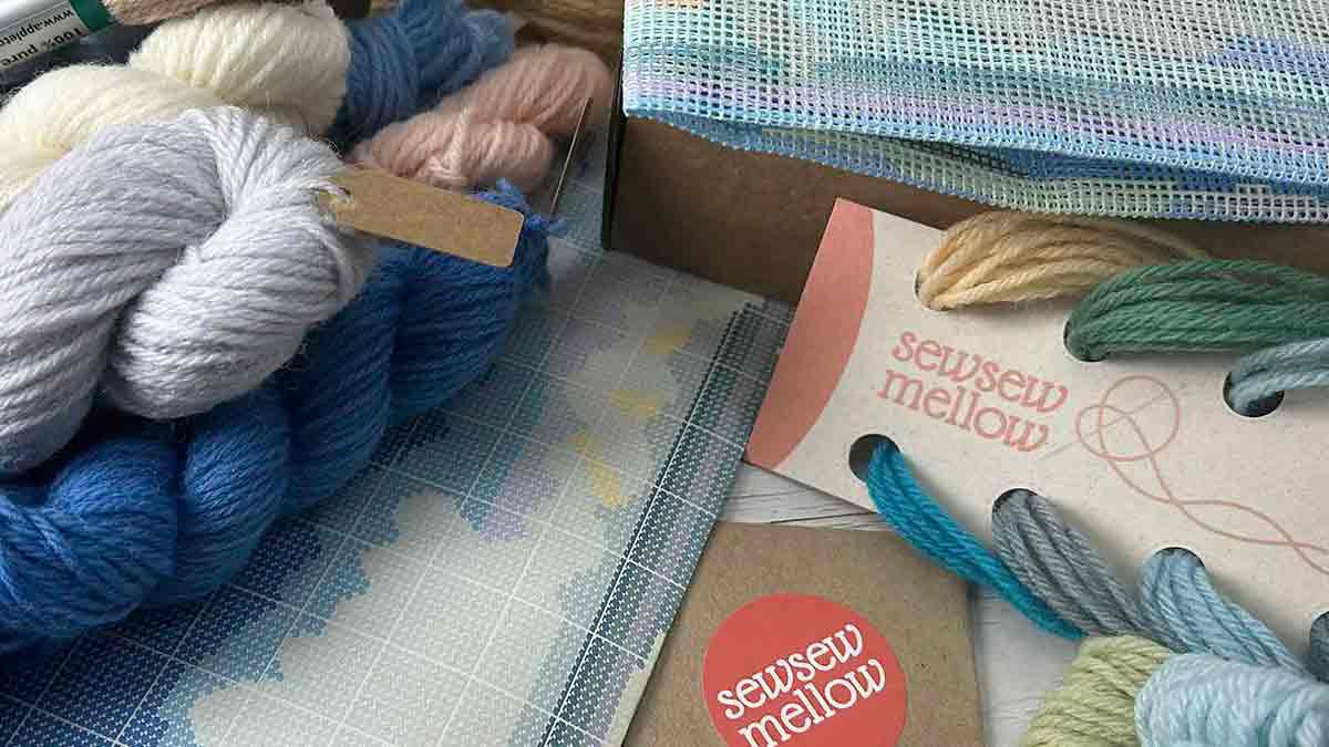 The contents of a Sew Sew Mellow needlepoint tapestry kit